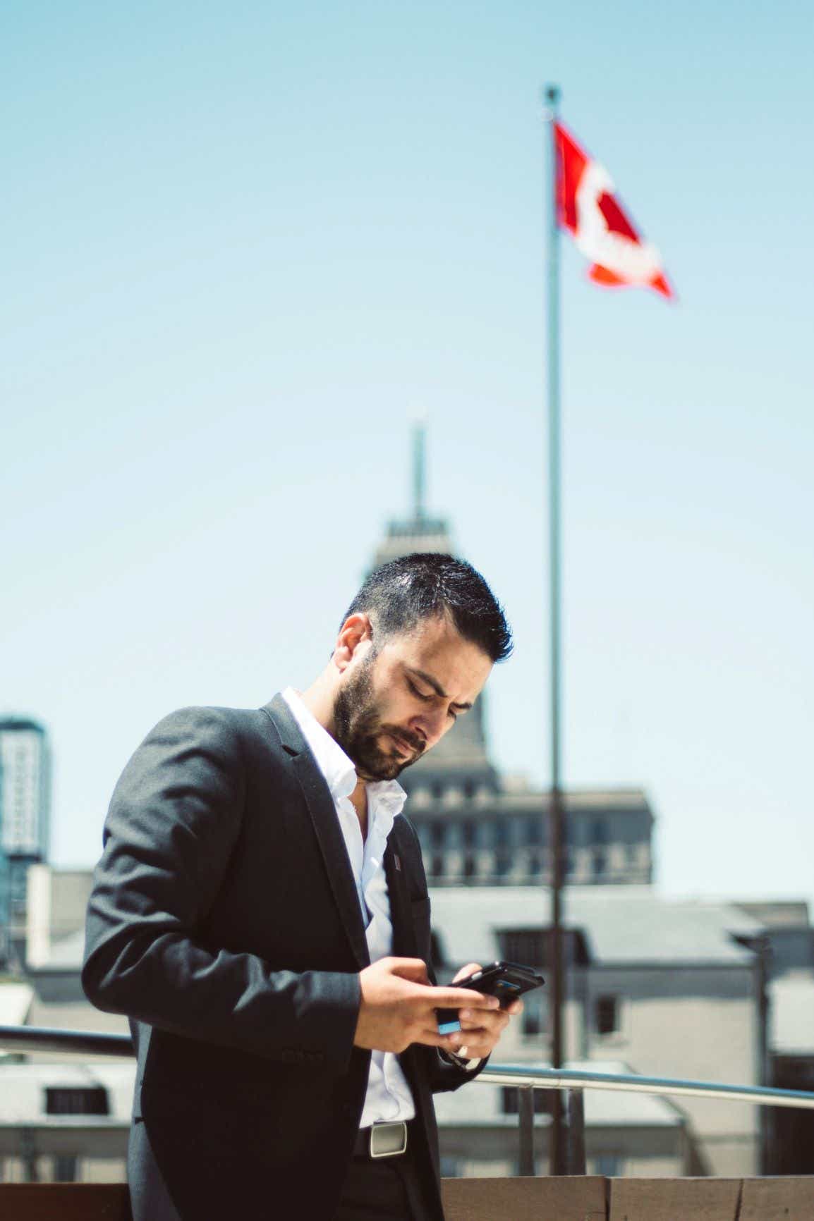 a young man looking at his cellphone